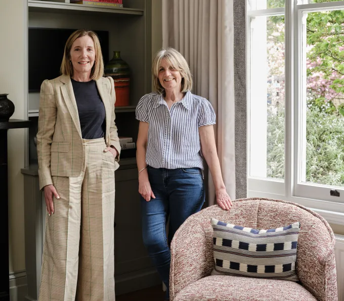 Katherine Brown with her colleague Sara in a north London sitting room dressed with bespoke pinch pleat curtains by Katherine Brown Curtains and Blinds